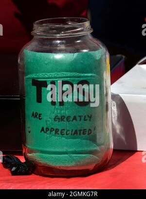 A tip jar at an outdoor  food vendor booth in Santa Fe, New Mexico. Stock Photo