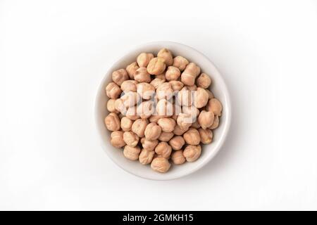 top view of chickpeas in white bowl isolated on white background Stock Photo