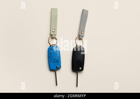 Car keys with leather keychains on light background Stock Photo