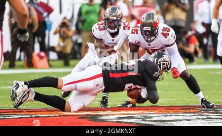 Tampa Bay Buccaneers' wide reciever Charles Lee (82) tries to elude a  tackle from Houston Texans' Marcus Coleman (42) during the Bucs' 16-3 win  against the Texans at Raymond James Stadium in