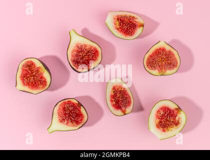 Fresh fig fruits isolated on pink background. Table top view. Stock Photo