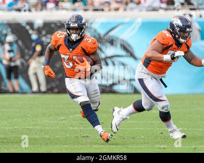 DENVER, CO - NOVEMBER 14: Denver Broncos running back Javonte Williams (33)  rushes during a game between the Denver Broncos and the Philadelphia Eagles  at Empower Field at Mile High on November