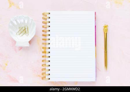 Woman To Do List and pen on pink background Stock Photo