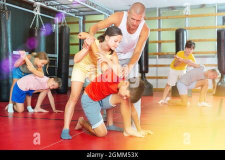 Young boys and girls on self-defence training Stock Photo