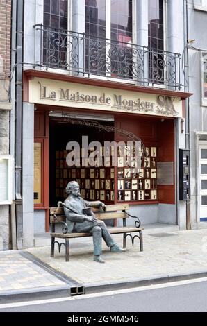 Dinant, Belgium 08-17-2014 Saxophone Museum and sculpture of Adolphe Sax on a bench Stock Photo