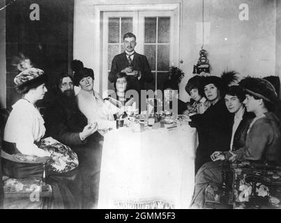 Grigory Yefimovich Rasputin,  peasant, mystic and self styled holy man who had a magnetic influence over Alexandra and her husband, Tsar Nicholas II in the midst of a group of his followers. Stock Photo