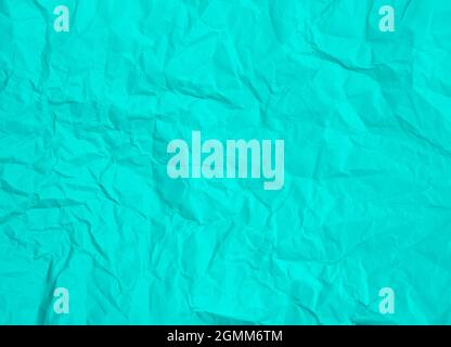 Crumpled turquoise paper background texture Stock Photo