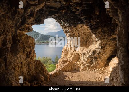 Look out from the small cave on the Mediterranean coast in Turkey Stock Photo