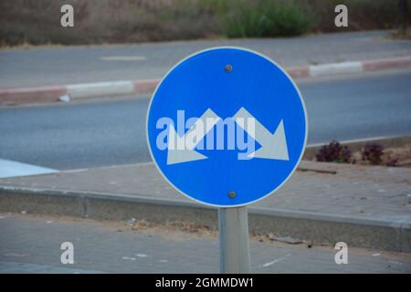 Traffic direction sign 'Pass either side'. Pass designated place on right or left sign. Mandatory signs. Road signs in Israel Stock Photo