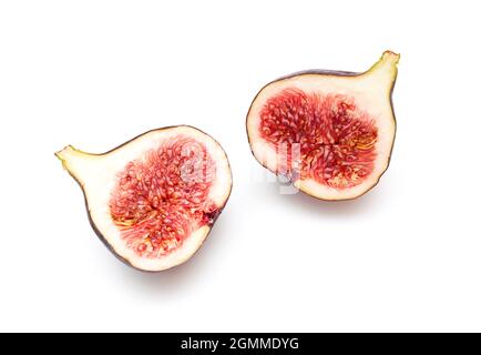 Two pieces, slices of ripple figs isolated on white, top view, space for text Stock Photo