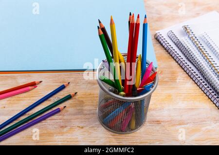 Colored pencils kept in pencil holder Stock Photo