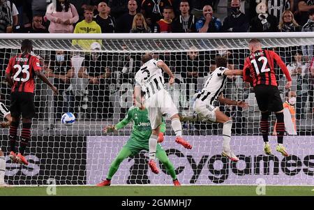 Turin, Italy. 19th Sep, 2021. AC Milan's Ante Rebic (1st R) scores his goal during a Serie A football match between FC Juventus and AC Milan in Turin, Italy, on Sept. 19, 2021. Credit: Federico Tardito/Xinhua/Alamy Live News Stock Photo