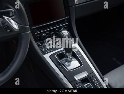 Automatic gear parked inside modern vehicle sports car automobile. Automatic gearbox shifter Stock Photo