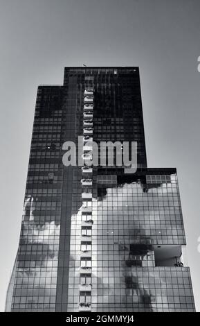 Reflections of Clouds on a Building Stock Photo