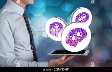 Deep learning concept above a tablet held by a man Stock Photo