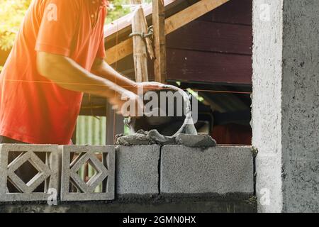 Motion blur bricklayer man working build for construction at home Stock Photo