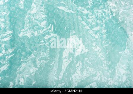 White bubble wrap packing texture on bluefor your creative backgrounds. Stock Photo