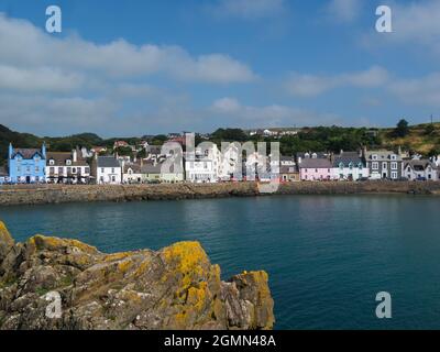 View across to hotels and houses on seafront of Portpatrick village Dumfries and Galloway Scotland on a lovely September day Stock Photo