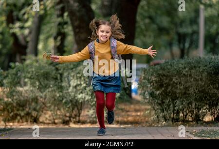 Preteen school girl with backpack Stock Photo