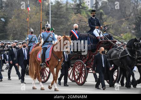Santiago, Chile. 19th Sep, 2021. Chilean president Sebastian Pinera (C) attends an annual military parade to celebrate the Day of the Glories of the Army at the O'Higgins park, in Santiago, Chile, on Sept. 19, 2021. Credit: Jorge Villegas/Xinhua/Alamy Live News Stock Photo