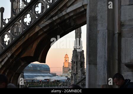 Sunset in background from rooftop of Duomo Di Milano Stock Photo