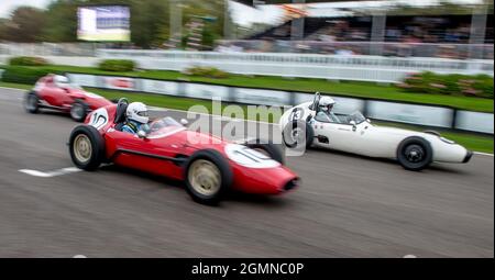 Goodwood, UK. 19th Sep, 2021. Graham Adelman driving an OSCA Fiat FJ draws close to Crispian Besley in his Elva BMC 100 in the Chichester Cup race at the Goodwood Revival Festival at the Goodwood Circuit, Sussex, UK on 19 September 2021. Photo by Phil Hutchinson. Editorial use only, license required for commercial use. No use in betting, games or a single club/league/player publications. Credit: UK Sports Pics Ltd/Alamy Live News Stock Photo