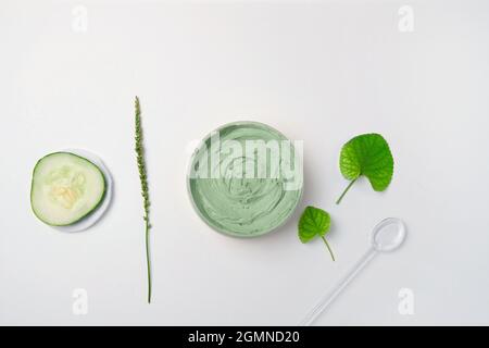 Handmade organic bio nature cosmetics with herbal ingredients. Skin care cream on gray background with copy space Stock Photo