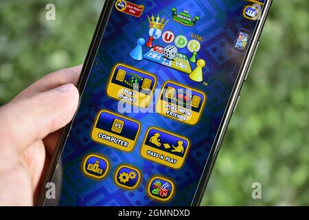 New Delhi, India, 12 April 2020:- Playing Ludo King on Smartphone Stock Photo