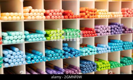 Watercolor pencils are arranged by color in cells on a stationery store  shelf. A variety of professional colored pencils for artists and designers.  Sh Stock Photo - Alamy