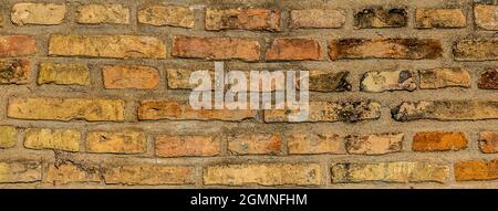 Old grunge brown brick wall banner background Stock Photo