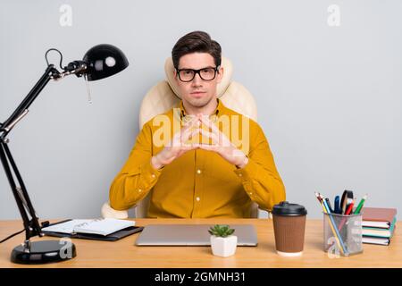 Portrait of attractive focused specialist expert hr manager waiting interview isolated over grey color background Stock Photo
