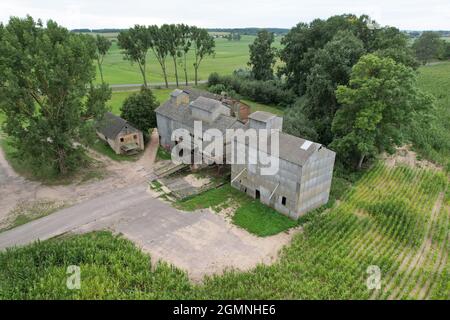 Old beer factory aerial drone view around agriculture field Stock Photo