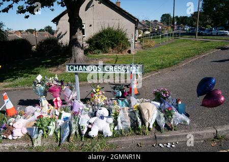 Floral tributes at the scene in Chandos Crescent in Killamarsh, near Sheffield, where four people were found dead at a house on Sunday. Derbyshire Police said a man is in police custody and they are not looking for anyone else in connection with the deaths. Picture date: Monday September 20, 2021. Stock Photo
