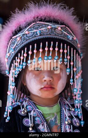 Nan, Thailand - DECEMBER 22, 2011: Portrait of a little Hmong tribe girl in traditional clothing during Hmong New Year’s celebration. Khun Sathan. Stock Photo