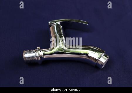 Silvers tap with blue background Stock Photo