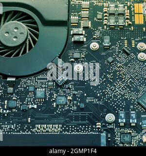 Laptop Motherboard . Extreme close up. Green printed computer motherboard with microcircuit. Stock Image. Stock Photo