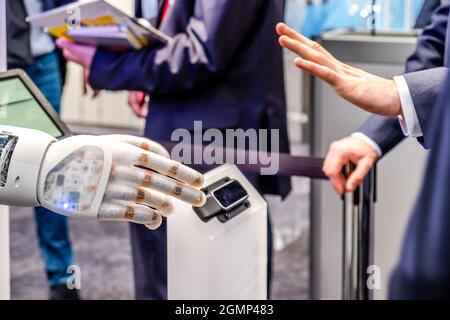 Human hand and robot's as a symbol of connection between people and artificial intelligence technology. Stock Photo