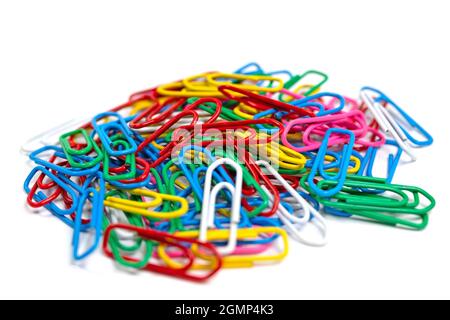 Lots of colorful paper clips against a white background Stock Photo