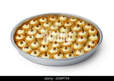 Assortment of Turkish baklava dessert in metal tray isolated on white Stock Photo