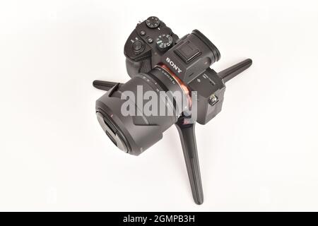 New Delhi, India- October 5, 2020: Sony camera on mini tripod over white background Stock Photo