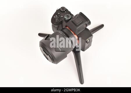 Digital Camera on mini tripod isolated on white background Stock Photo