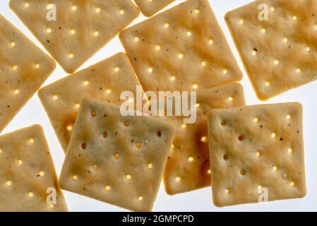 stack of square crackers in backlight isolated on white background Stock Photo