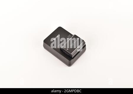 Camera battery charging Isolated on White Background Stock Photo