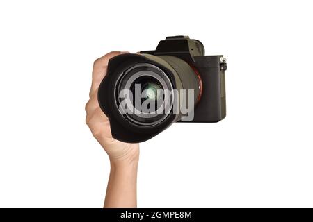 Shooting with Camera, Hand Holding Camera Isolated on White Background With Clipping Path Stock Photo