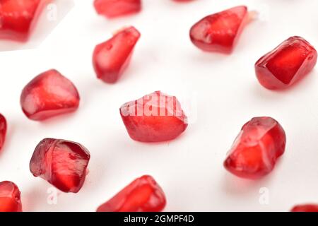 pomegranate seeds isolated on white background, macro Stock Photo