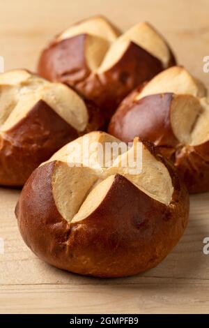 Fresh baked German Lye rolls close up on a cutting board Stock Photo