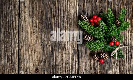 Christmas tree branch on old wooden planks Stock Photo