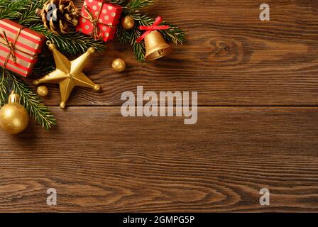 Christmas background with Fir tree branches pine cone and red gift boxes Stock Photo