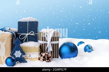 Christmas gift boxes in snow. Stock Photo