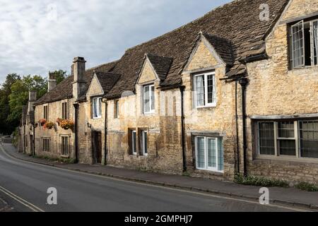 Lovely old stone traditional cottages in The Street in the unspoilt Cotswold village of Castle Combe, Wiltshire, England, UK Stock Photo